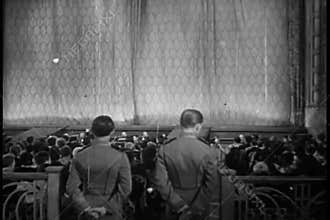 Rear view of audience clapping after stage performance