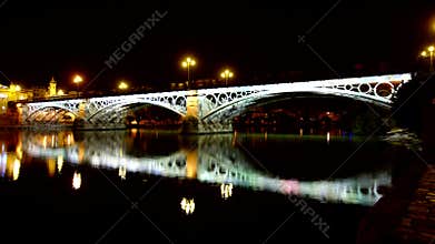 Guadalquivir river in Seville at Night.