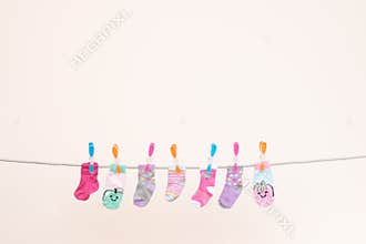 Seven Babies Socks On Washing Line Landscape