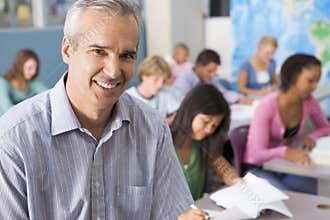 School children and their teacher in class