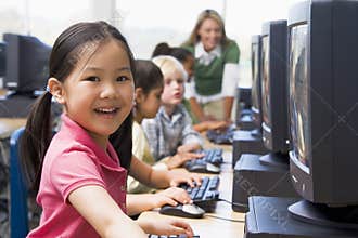 Children learning how to use computers.