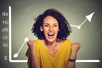 Successful business woman pumping fists happy with wealth growth