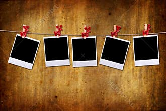 Empty photo frames over grunge background