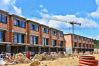 Crane and construction of new buildings. Beautiful background for the construction industry. New home.