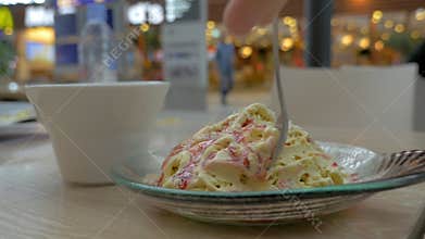 Eating dessert in trade centre cafe