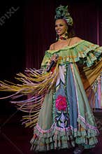 A Cuban female singer in traditional attire during Cabaret Parisien performance