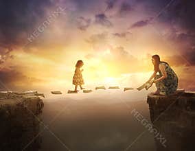 Child walking on pages over cliff