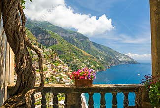 Beautiful view of the town of Positano from antique terrace with flowers
