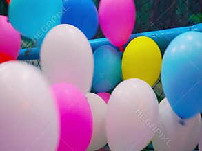 Colorful balloon blowing around