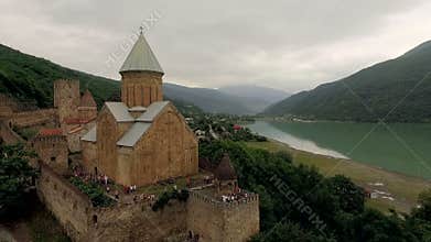 Picturesque landscape, mountains, sea, castle. Ananuri, Georgia. Ðerial survey monastery.