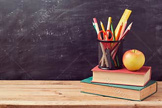Back to school background with books, pencils and apple