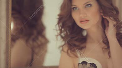 Beautiful girl posing for a photographer at the