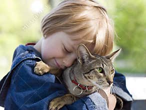 Blond boy with oriental bred cat