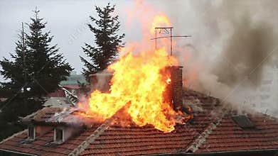 A burning house roof top