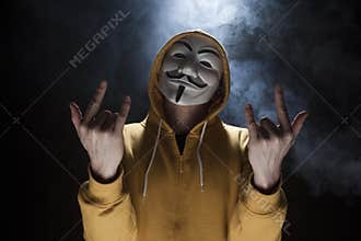Anonymous activist hacker with mask studio shot