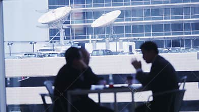 Business people in meeting in airport.