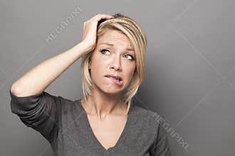 Doubt and worry concept for anxious 20s blond woman