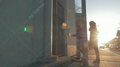 Man and woman returning home after shopping