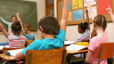 Children classroom raising hands