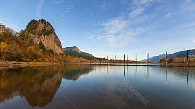 Time Lapse of Clouds and Blue Sky Over Beacon Rock along Columbia River Gorge one Autumn Day