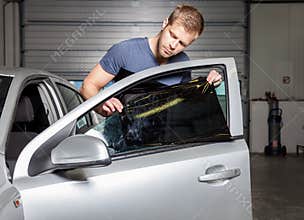 Applying tinting foil onto a car window