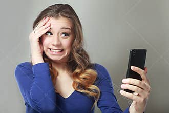 Shocked woman look at phone