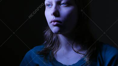 Close-up portrait of depressed teenager being sad. 4K UHD