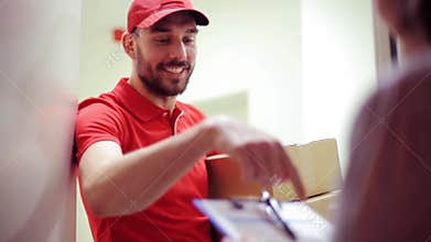 Happy man delivering parcel boxes to customer home