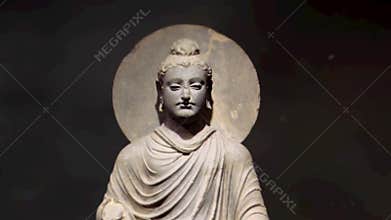 Buddha Sculpture Slow Motion on a Black Background