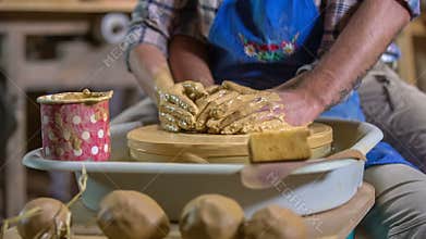 Couple making pots with there hands