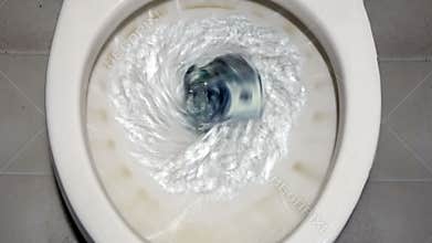 Flushing $100 bills down the toilet