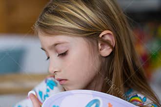 Young girl with thoughtful expression
