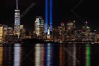 9/11 Memorial Beams with Statue of Liberty and Lower Manhattan