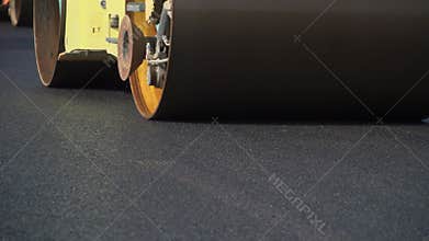 Construction of asphalt road. Laying the roadway roller