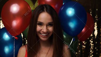 Birthday Celebration. Woman Blowing Soap Bubbles With Balloons