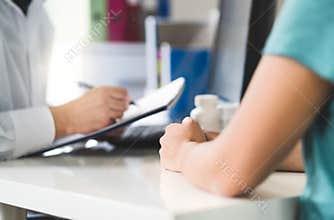 Sick patient visiting doctor in health care center or emergency room.