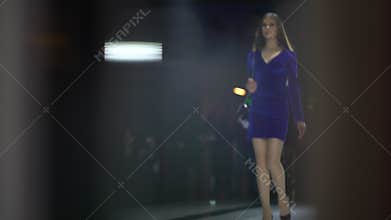 Fashion show. Fashion podium, female top model women girls in stylish dresses of designer walking on runway at defile