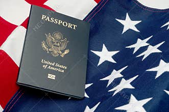 An American passport on an American flag