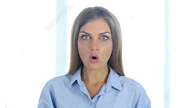 Portrait of wondering young woman gesturing shock, astonished