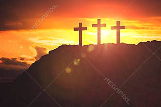 Silhouettes of three crosses at sunset on hill. Religion and christianity concept