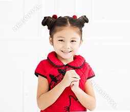 Chinese little girl with congratulation gesture