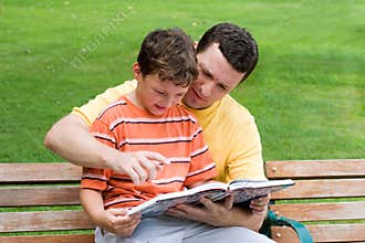 Father and son reading