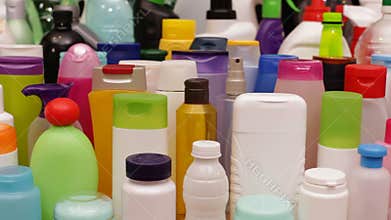 Closeup slide in front of lots of plastic bottles