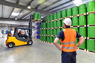 Group of workers in the logistics industry work in a warehouse w