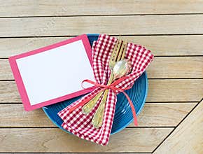 Summer Picnic Outdoor Table Placesetting with Red White and Blue Colors with fork and spoon with a Blank Card for your words, text