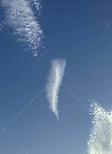 Feather-like cloud in the sky. Unseen reality from above.