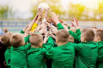 Kids Celebrating Soccer Victory. Young Football Players Holding Trophy