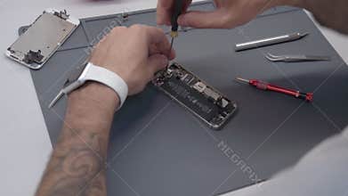 Close-up video showing process of mobile phone repair
