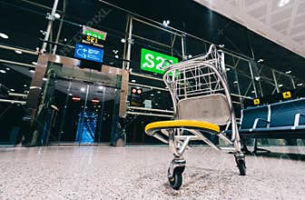 Luggage cart trolley at modern airport gate