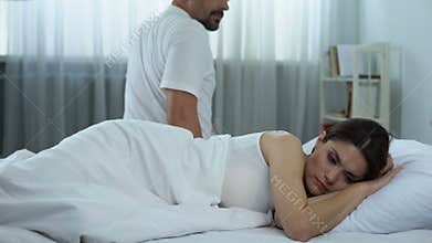 Couple in bed after quarrel, cheating problem in family, relationship crisis